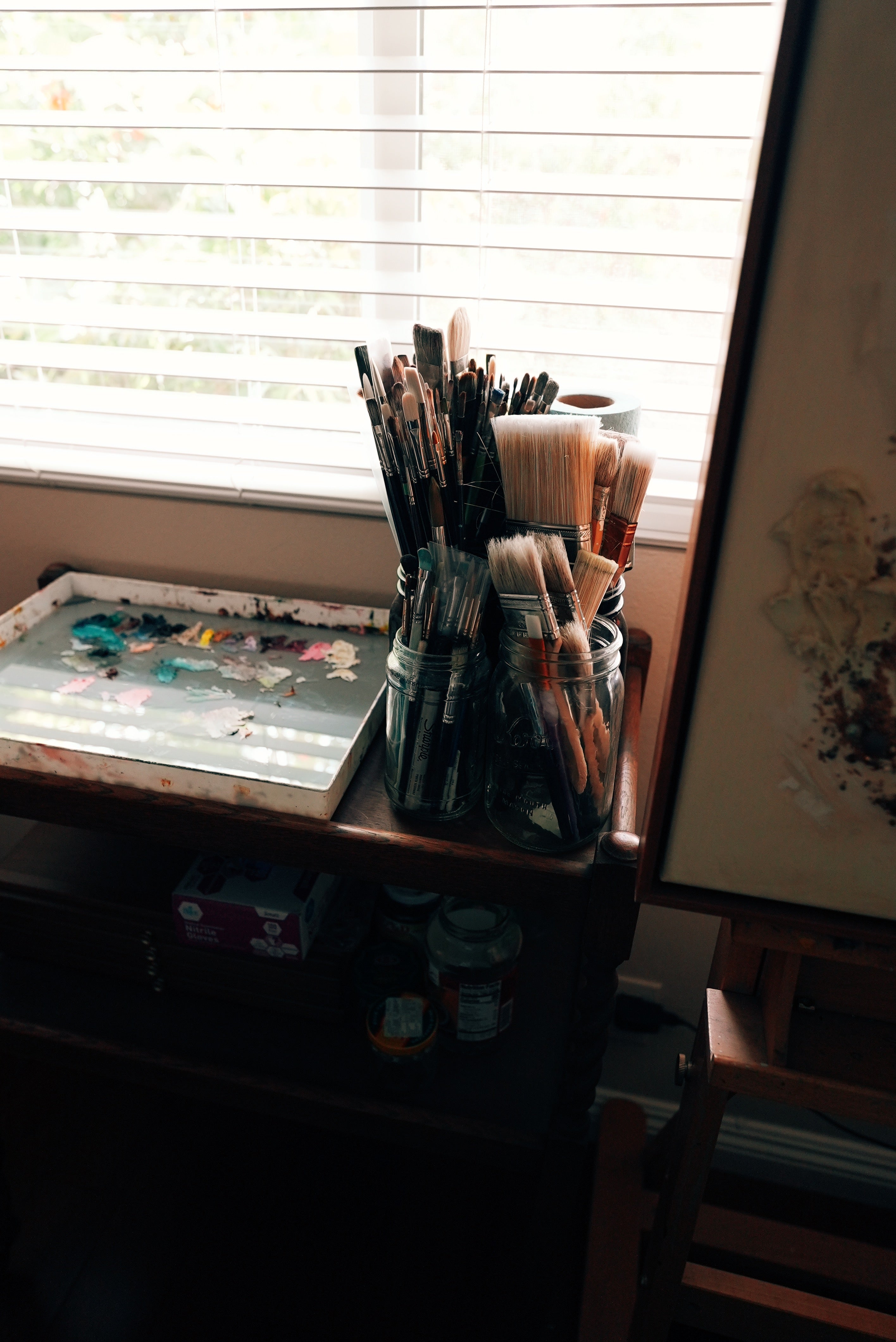 Jars of paintbrushes in my studio